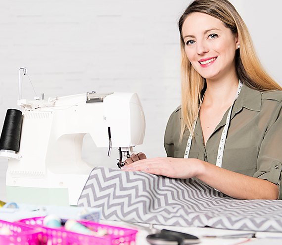 EarthingTek operator at an industrial sewing machine